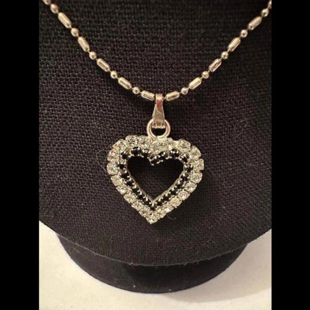 Embrace Timeless Elegance with a Black and White Heart-Shaped Necklace!
